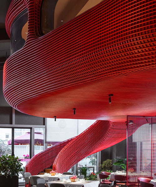 red rattan metal wraps around a restaurant in chengdu designed by IN • X