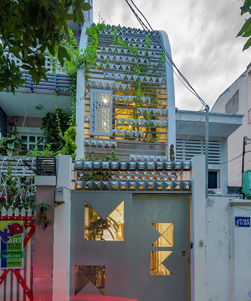 KHUÔN studio shields an inner oasis with 'armored' façade in ho chi minh city