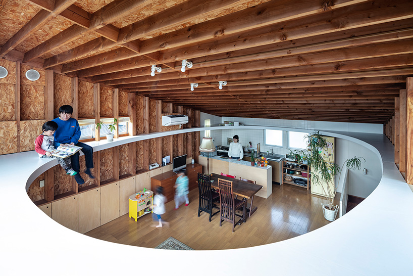 mtka adds inhabitable elliptical void below the roof of this house in tokyo