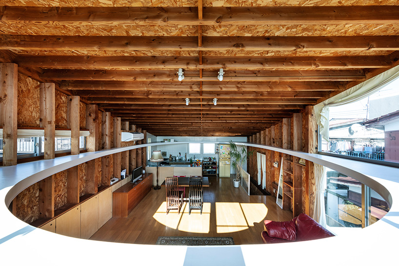 mtka adds inhabitable elliptical void below the roof of this house in tokyo