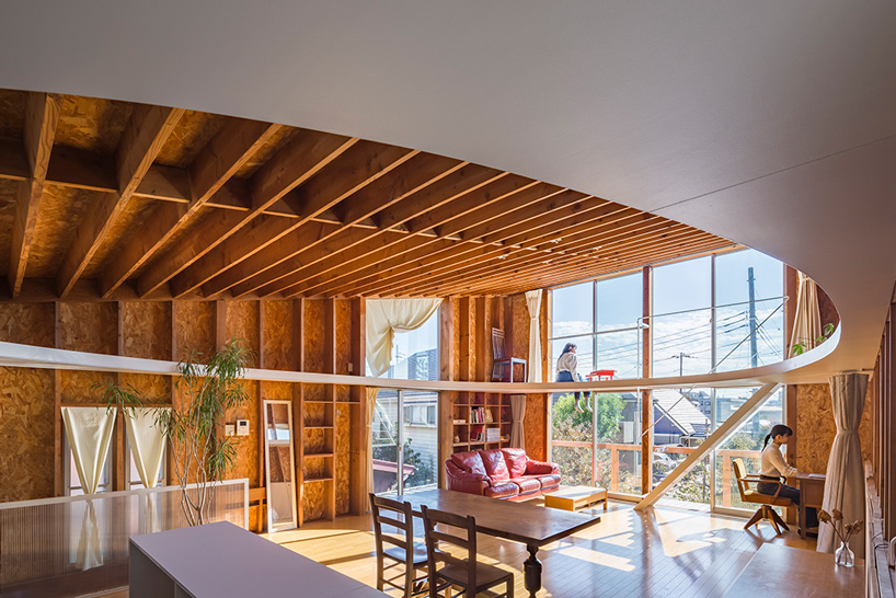 mtka adds inhabitable elliptical void below the roof of this house in tokyo