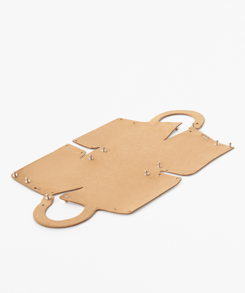 nendo designs 'flatpack' handbag made from a single piece of leather
