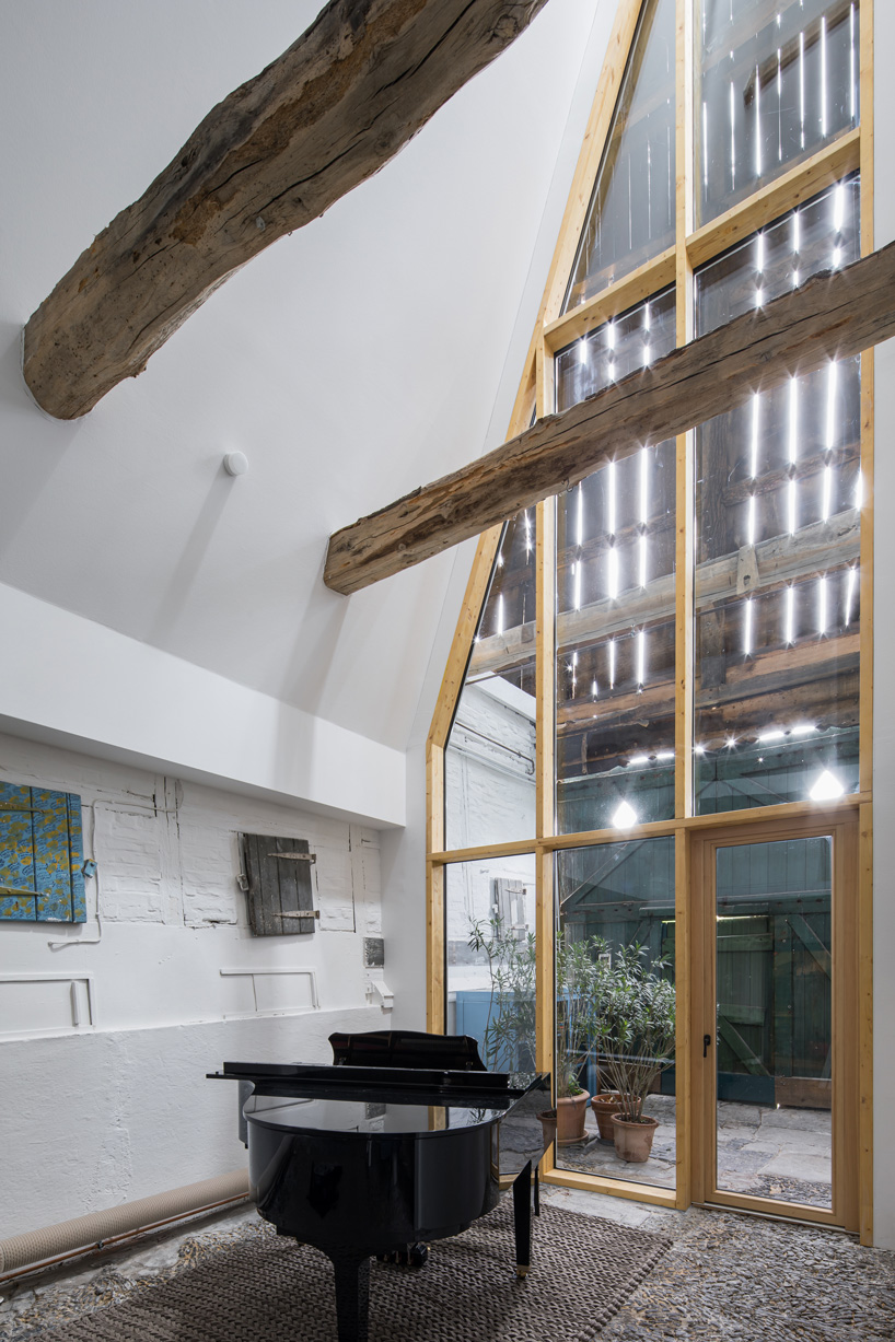 sigurd larsen sets dortmannhof house inside 200-year-old barn in western germany