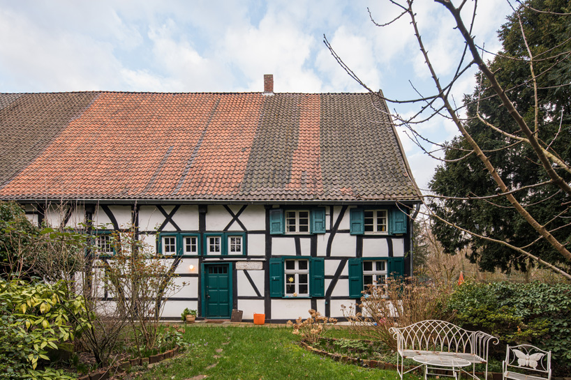 sigurd larsen sets dortmannhof house inside 200-year-old barn in western germany