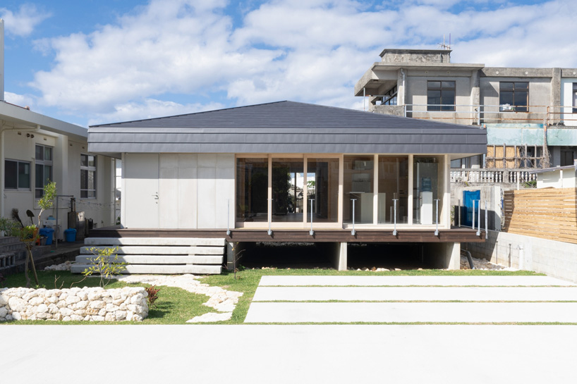 studio monaka lifts wooden house on set of concrete foundations in japan