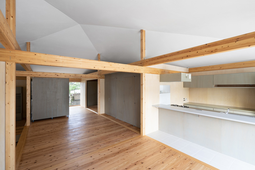 studio monaka lifts wooden house on set of concrete foundations in japan