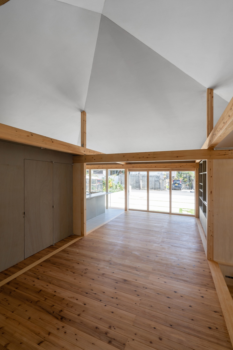 studio monaka lifts wooden house on set of concrete foundations in japan