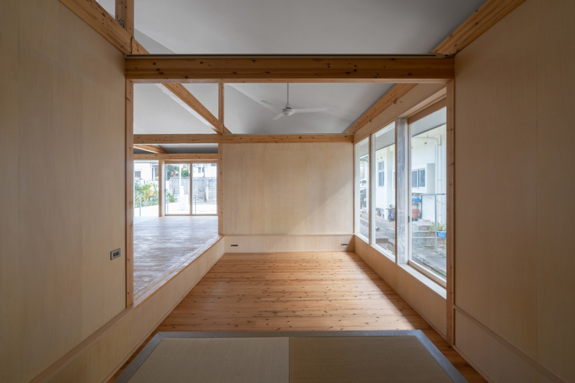 studio monaka lifts wooden house on set of concrete foundations in japan