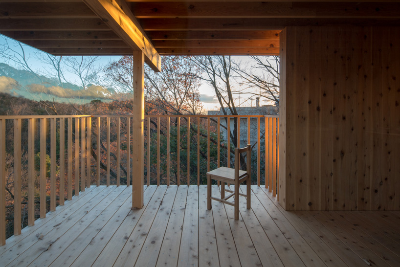 tomoaki uno architects places concrete + wood residence on steep slope in japan