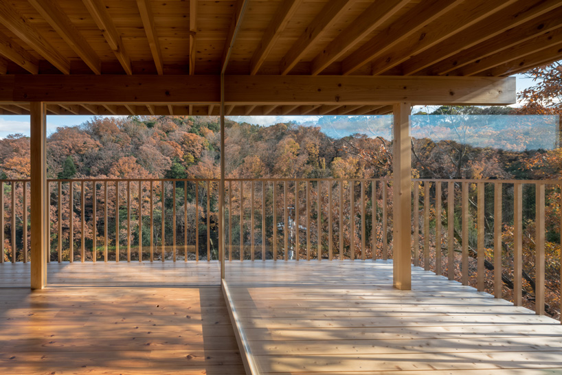 tomoaki uno architects places concrete + wood residence on steep slope in japan