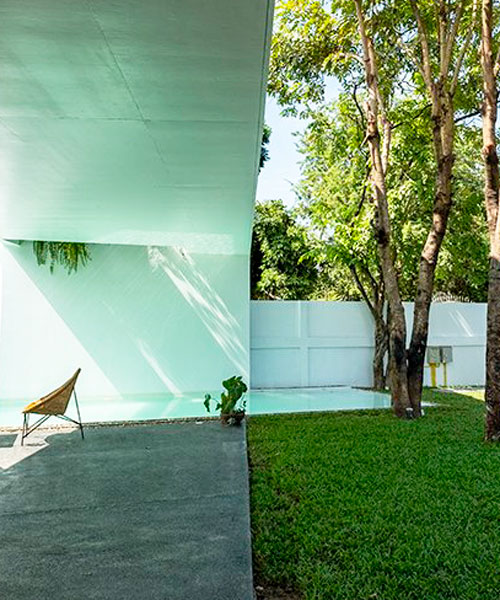 the white house by saola architects fuses indoors with garden space in laos