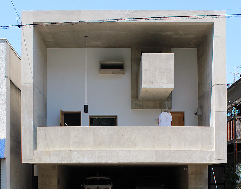 tomoaki uno architects builds concrete cuboid house with protruding balconies in japan