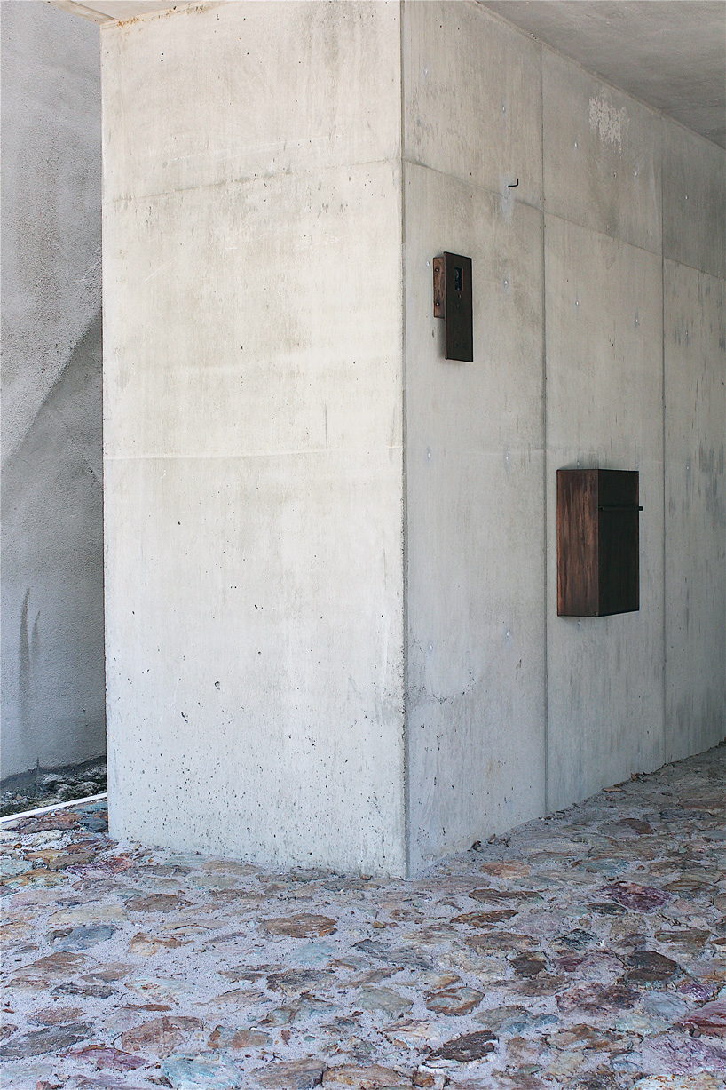 tomoaki uno architects builds concrete cuboid house with protruding balconies in japan