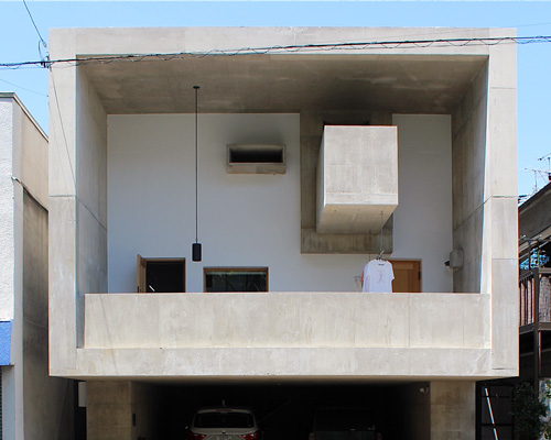 tomoaki uno architects builds concrete cuboid house with protruding balconies in japan