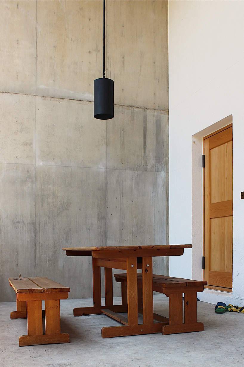 tomoaki uno architects builds concrete cuboid house with protruding balconies in japan