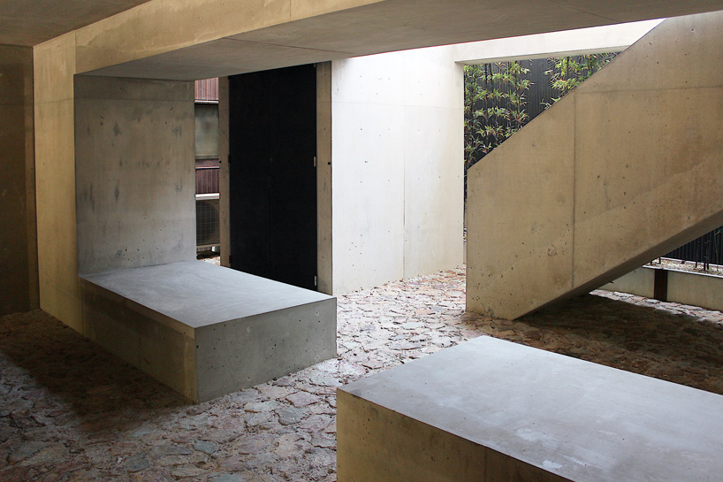 tomoaki uno architects builds concrete cuboid house with protruding balconies in japan