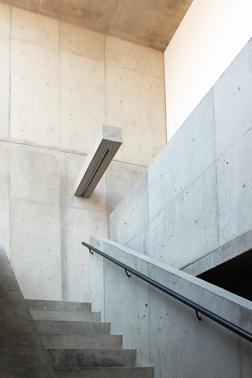 tomoaki uno architects builds concrete cuboid house with protruding balconies in japan