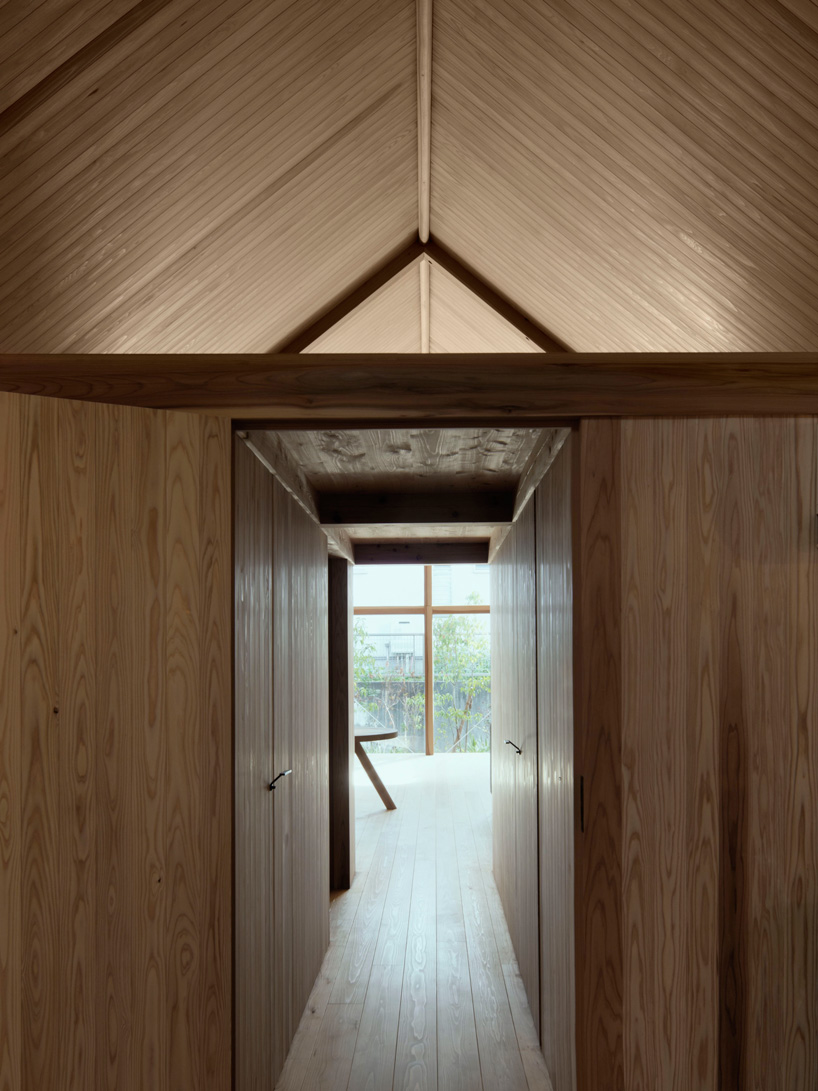 tomoaki uno architects completes wooden house in japan with blind street façade