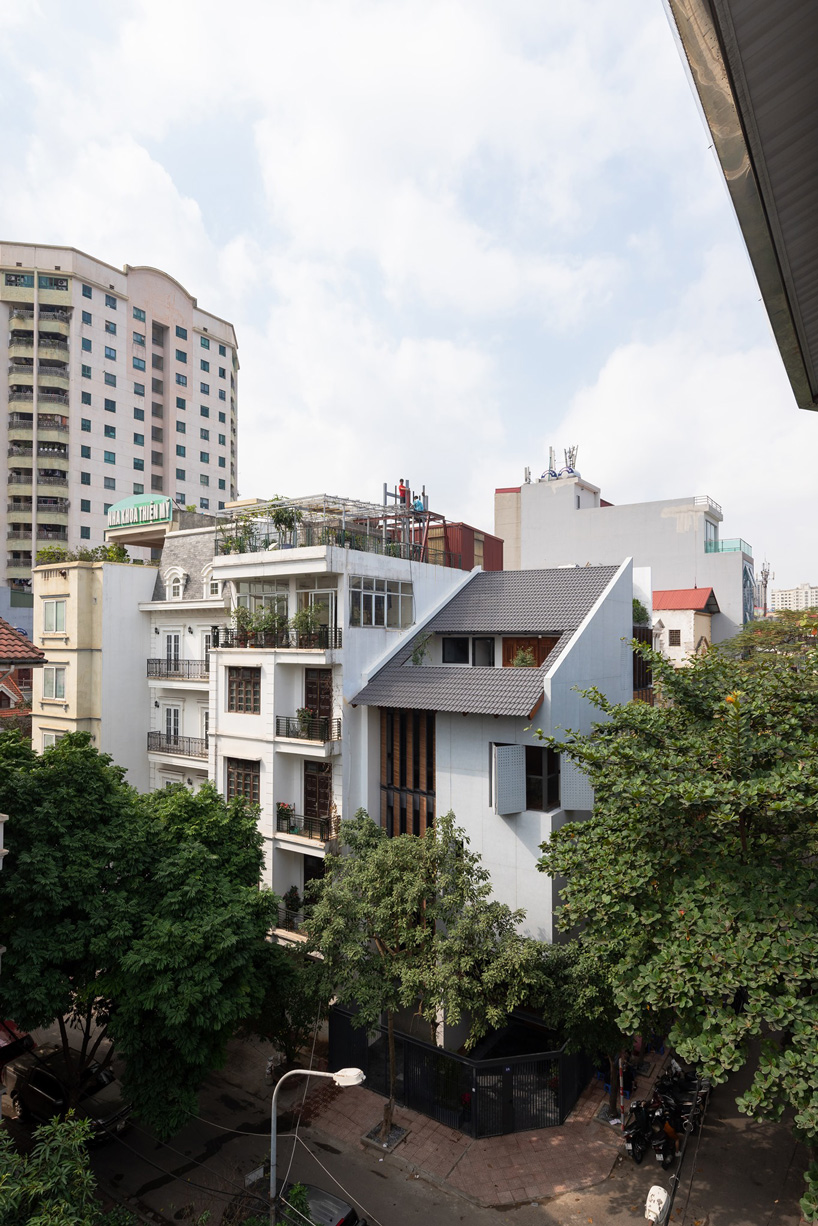 toob studio renovates corner house with series of openings in hanoi, vietnam