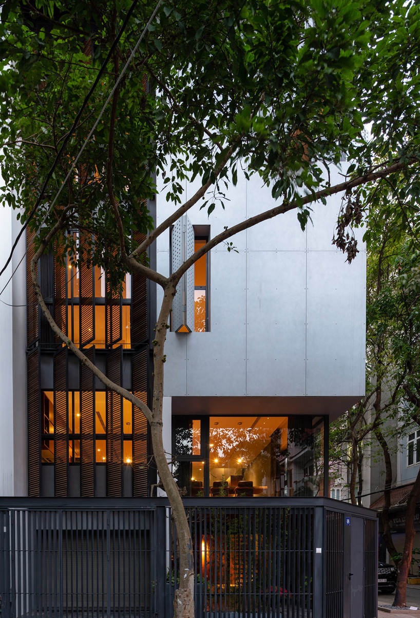 toob studio renovates corner house with series of openings in hanoi, vietnam