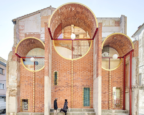 unparelld'arquitectes adds inhabitable brick façade to party wall in olot, spain