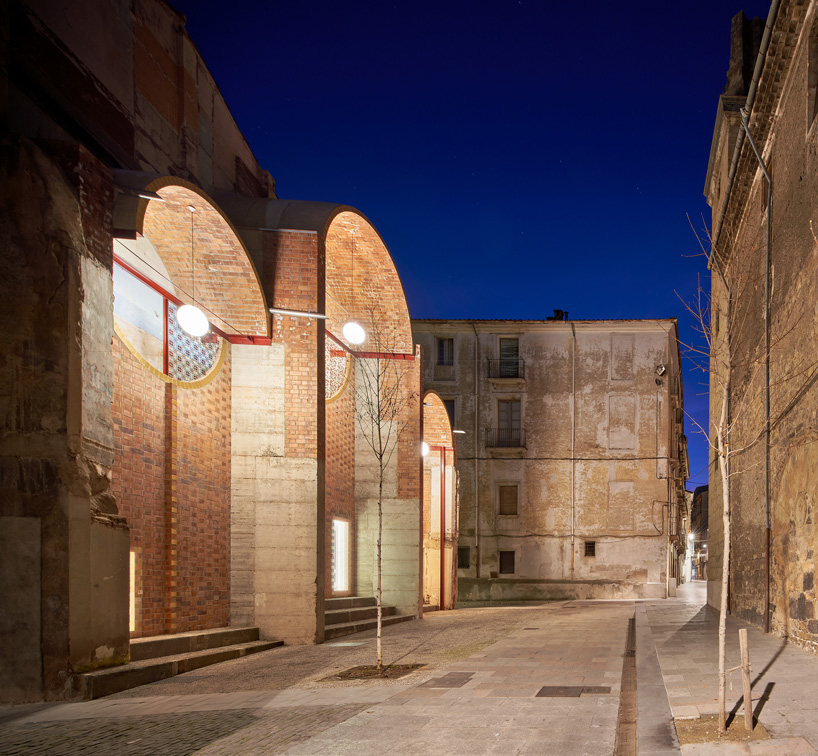 unparelld'arquitectes adds inhabitable brick façade to party wall in olot, spain
