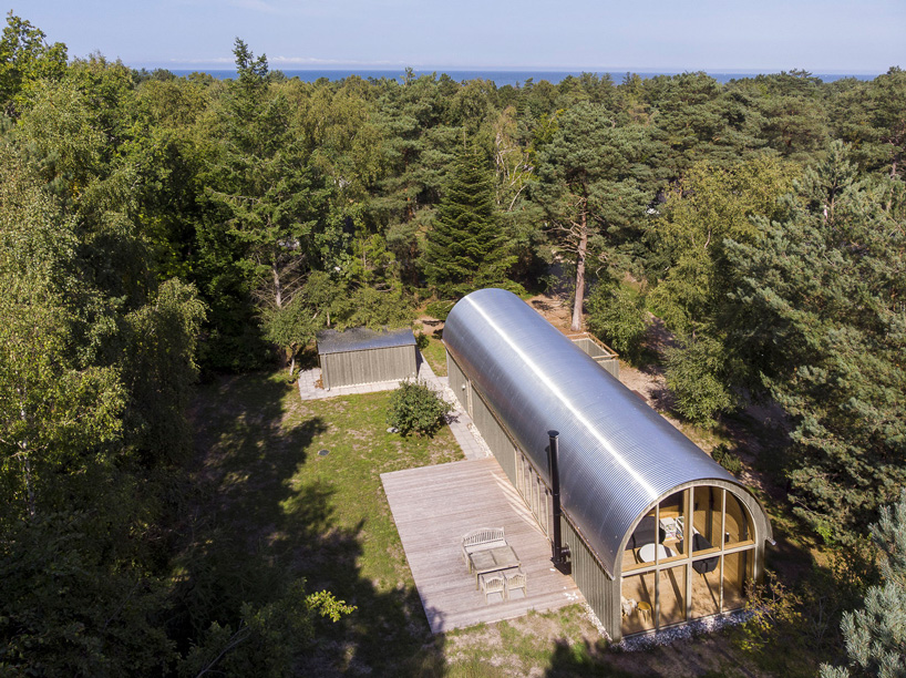 valbæk brørup architects tops wooden house in denmark with vaulted steel roof