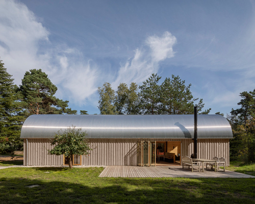 valbæk brørup architects tops wooden house in denmark with vaulted steel roof