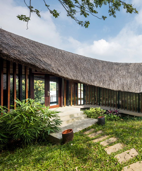 1+1>2 architects tops 'mother's house' in vietnam with thatched roof canopy