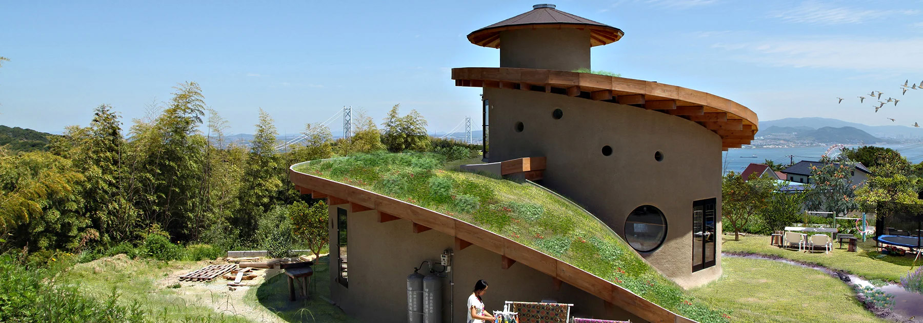 ryuichi ashizawa sets spiral family house with roof garden on awaji island in japan