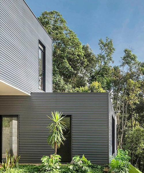bernardo horta + meius arquitetura build prefab house within mountainous landscape in brazil