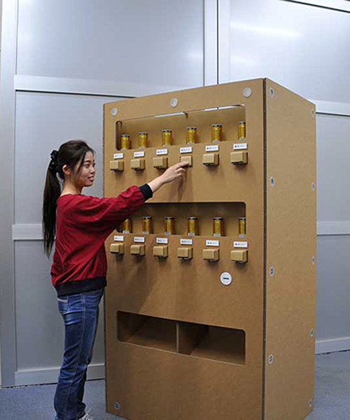 watch how this fully-functional, non-electric cardboard vending machine provides drinks
