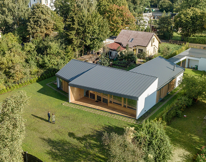 GAISS reinterprets traditional pitch roof typology with residential design in latvia
