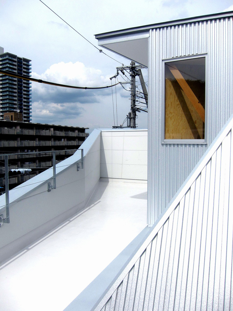 kensaku tohmoto architects combines house with gallery in otsu, japan