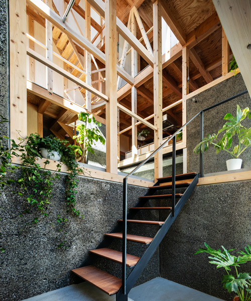 kiyoaki takeda's timber house with five retaining walls in tokyo merges nature with artefact