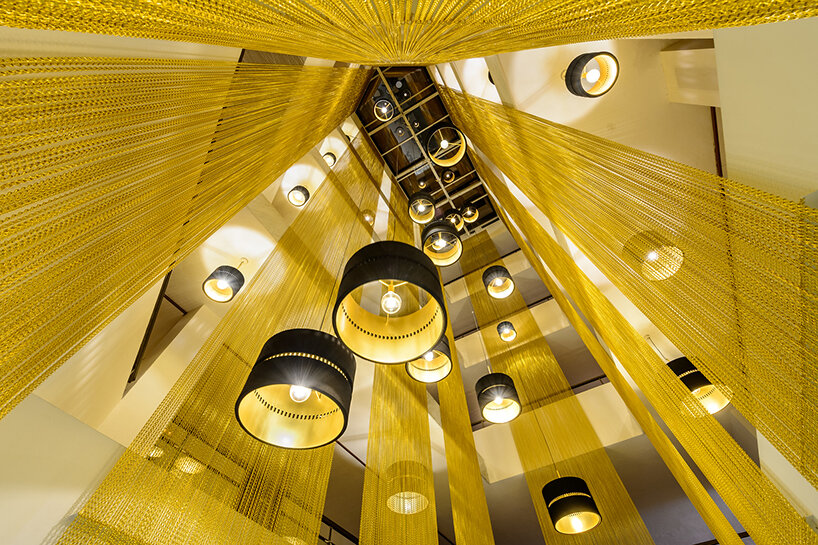 kriskadecor's bespoke, colorful wave-like chain curtains define spaces