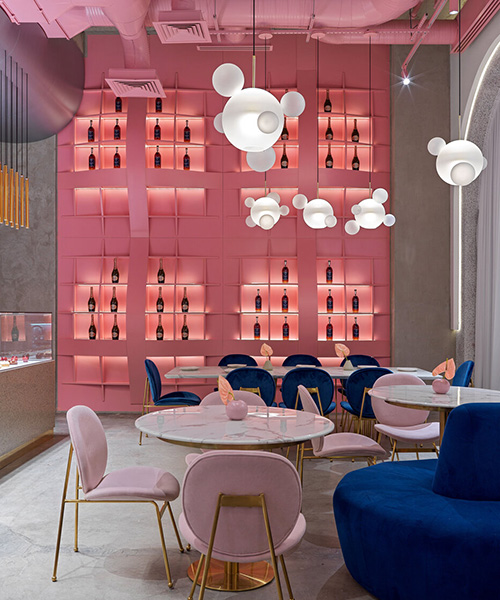 lenz/architects installs curved pink storage rack within 'dijon' restaurant in kazakhstan