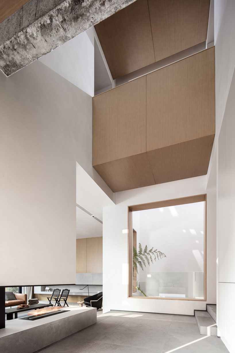 liang architecture inserts a light-filled atrium into apartment renovation in china designboom