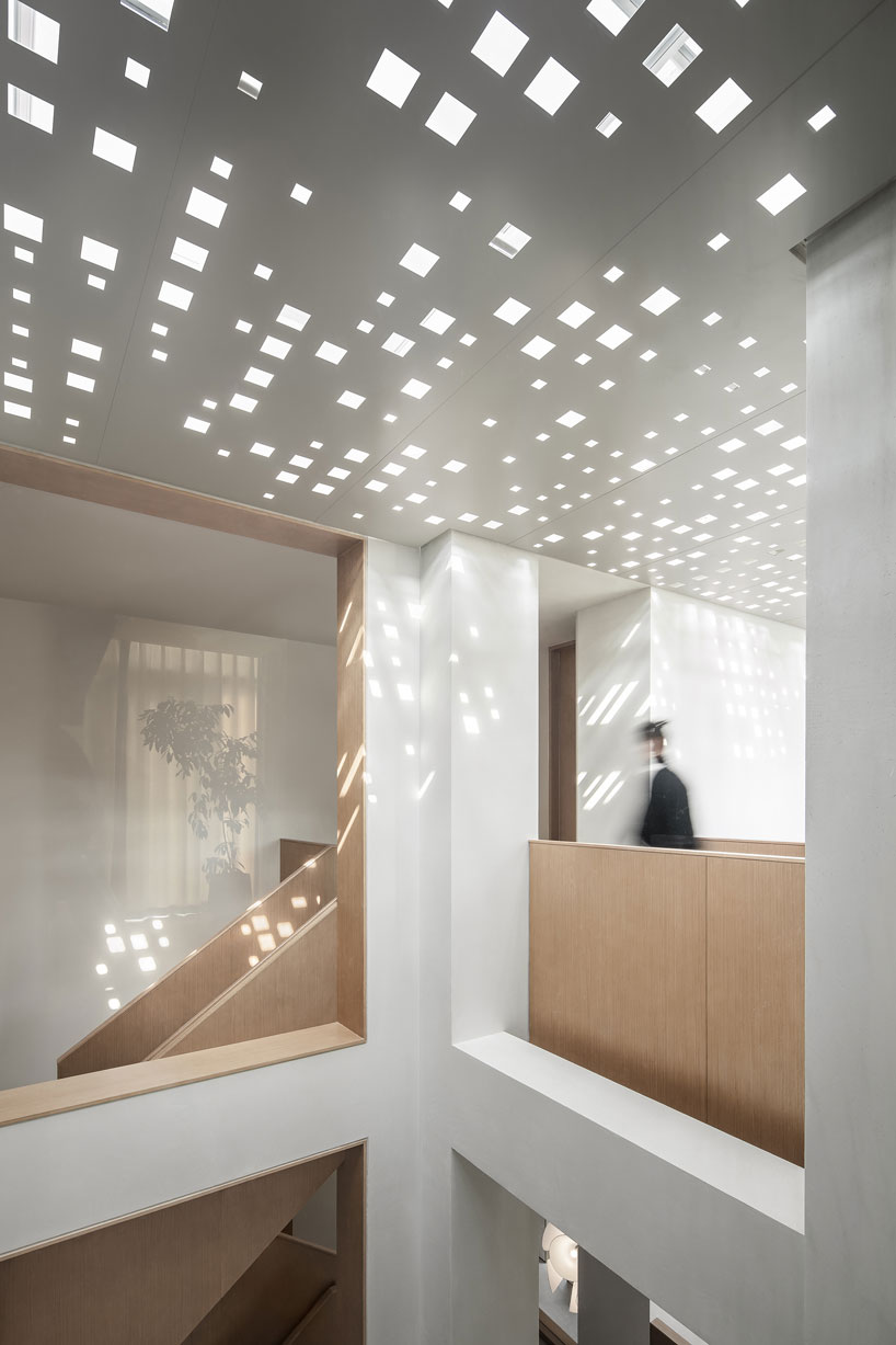 liang architecture inserts a light-filled atrium into apartment renovation in china designboom