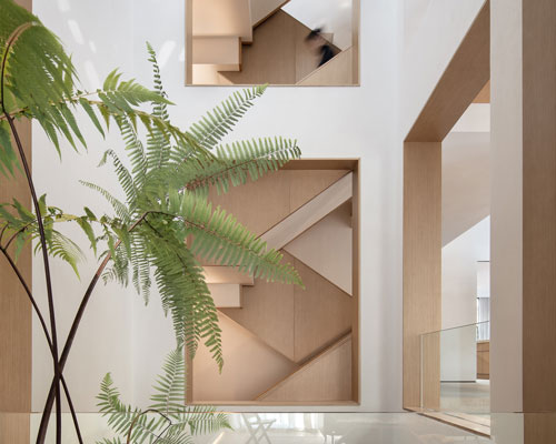 liang architecture inserts a light-filled atrium into apartment renovation in china