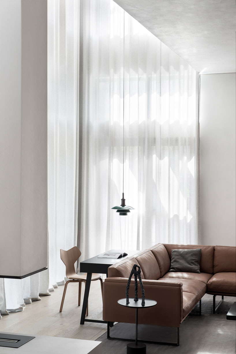 liang architecture inserts a light-filled atrium into apartment renovation in china designboom