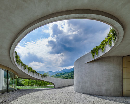 mino caggiula architects embeds atelier alice trepp into the contours of a swiss village