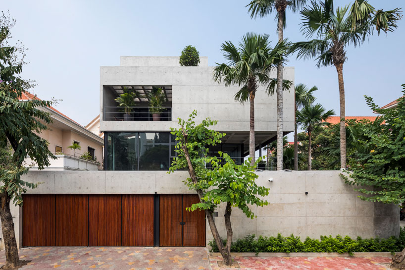 the bunker house by nha dan architects exposes the raw texture of ...