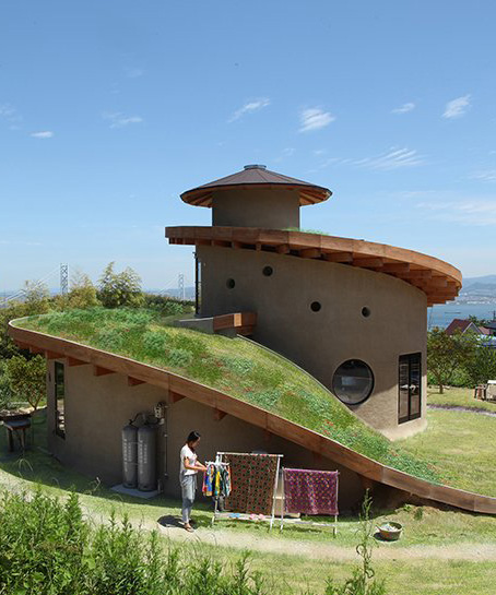 ryuichi ashizawa sets spiral family house with roof garden on awaji island in japan