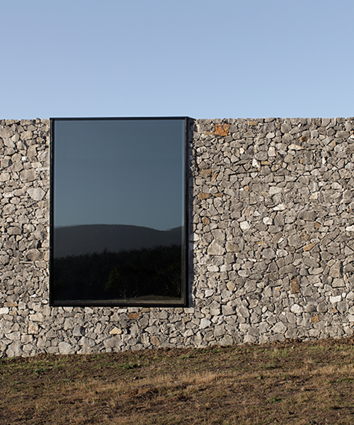 room 11 offers relief from tasmania's blinding sunlight with all-black interiors
