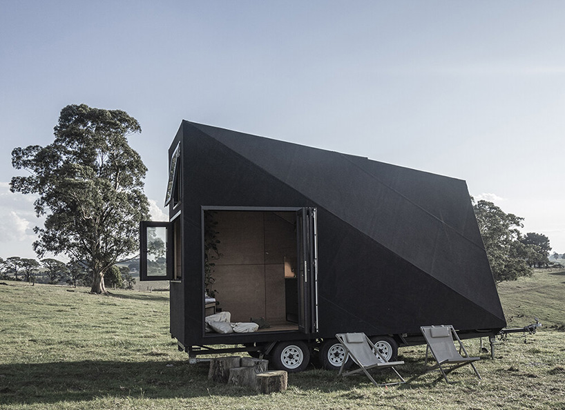 base cabin - studio edwards puts a sleek, black A-frame cabin on wheels