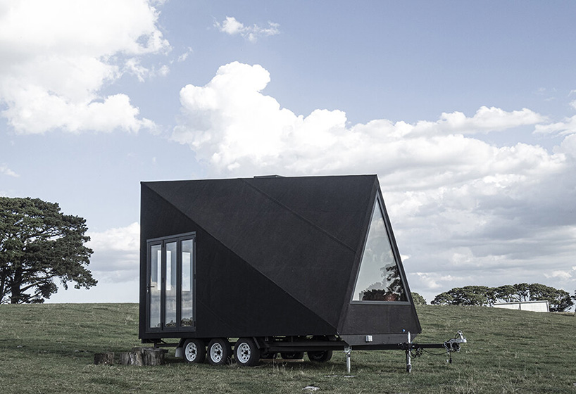 base cabin - studio edwards puts a sleek, black A-frame cabin on wheels