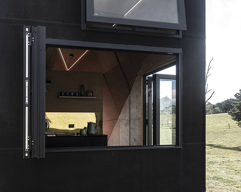 base cabin - studio edwards puts a sleek, black A-frame cabin on wheels