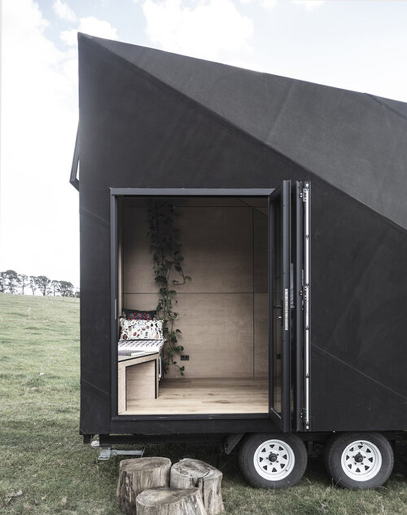 studio edwards puts a sleek, black A-frame cabin on wheels