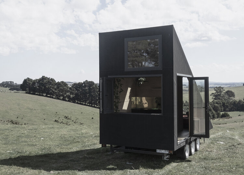 studio edwards puts a sleek, black A-frame cabin on wheels